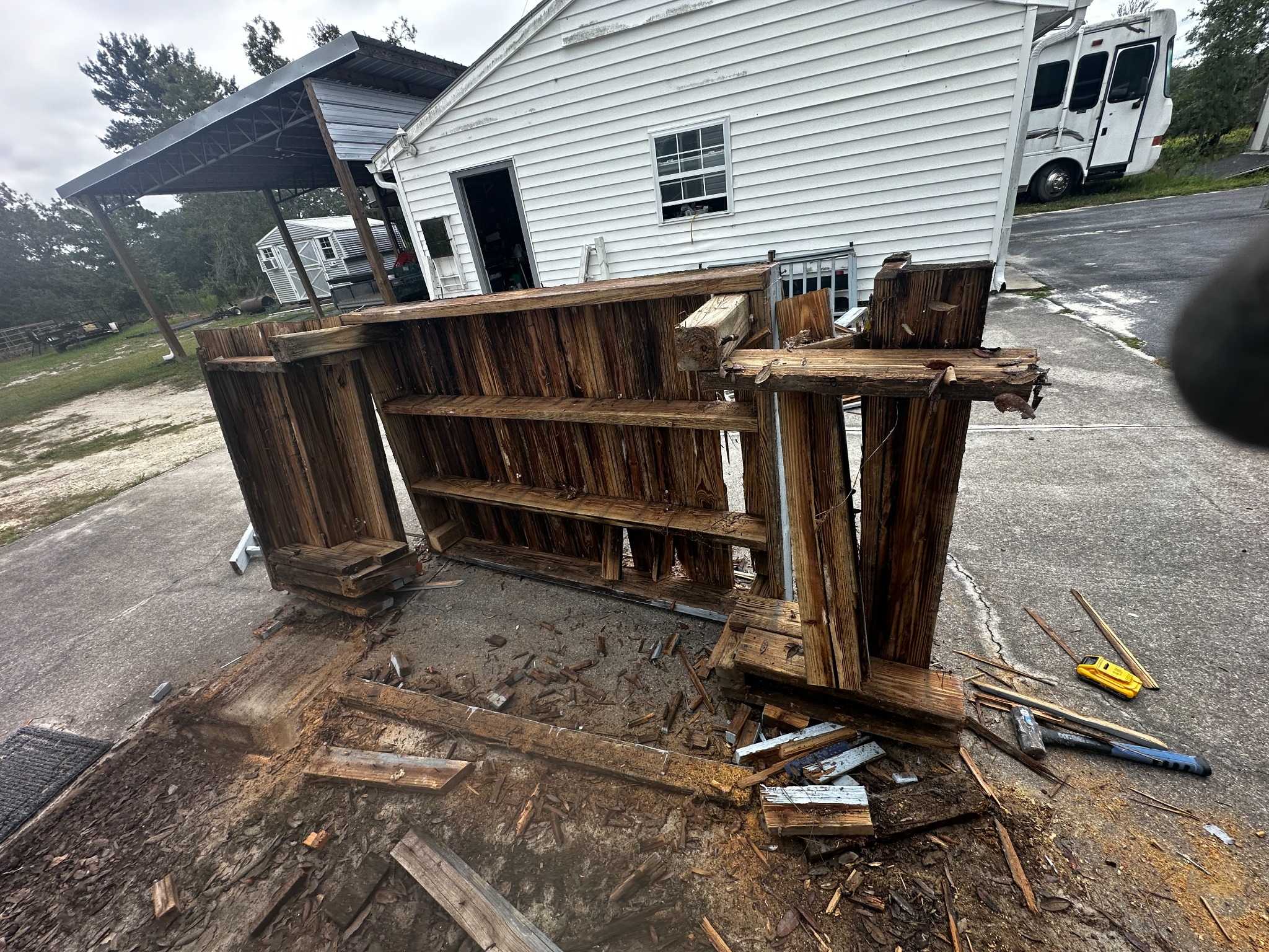 The old railing and deck components during demolition.
