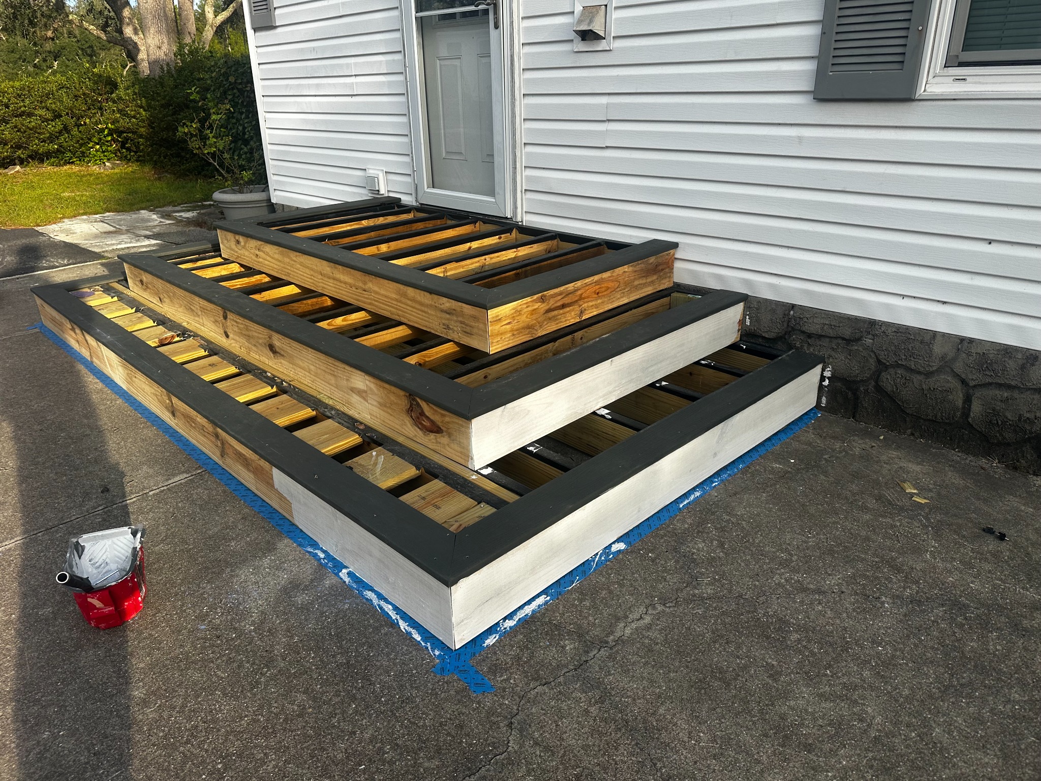The stepped layout and exposed framing before deck boards were placed.