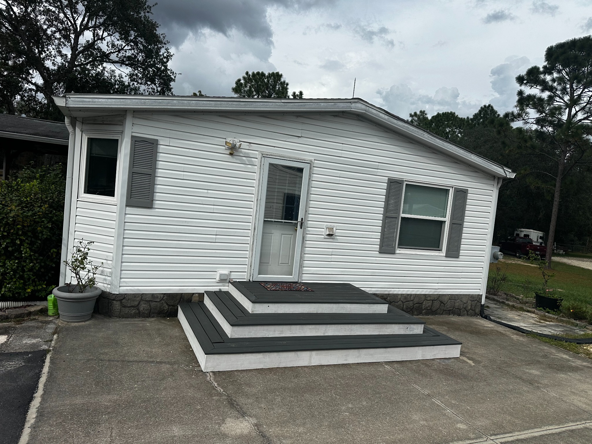 A new low-profile entry with broad, dark deck surfaces and light-colored risers.